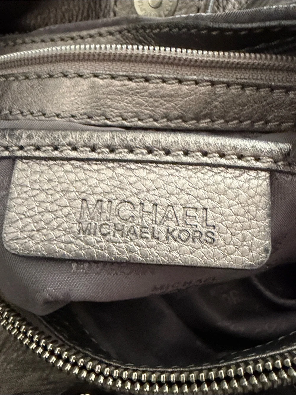 Michael Kors silvery Pebbled Leather Duffel with MK Charm